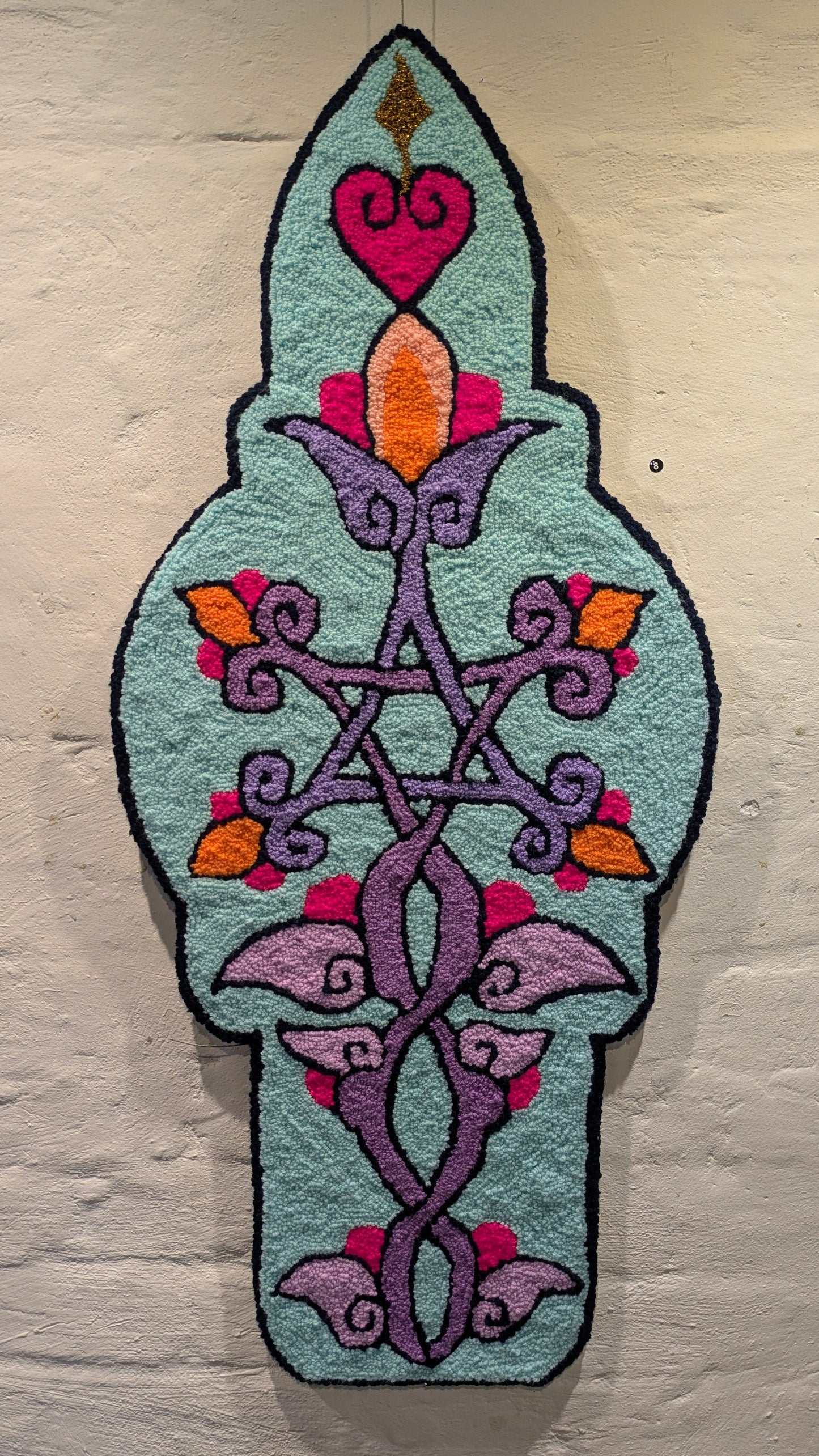 (8) Allanah Sarafian. Flower in the Margin. 2025. Tufted yarn and timber board