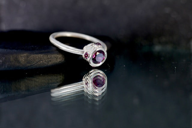 11. Robyn Clarke, Lagunas Ring 4, Laguna Colorado (contour line maquette), sterling silver, rhodolite garnets, size M