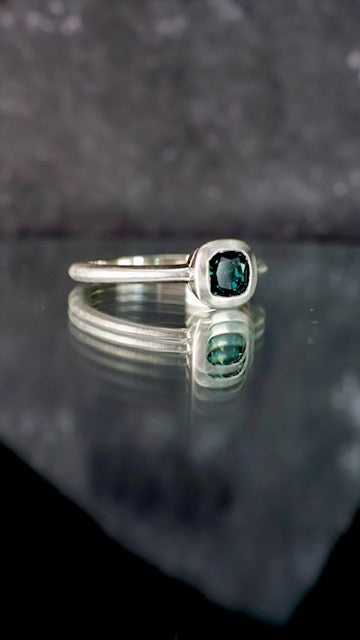 6. Robyn Clarke, Isla del Sol Ring 2, 9ct white gold, 0.84 carat cushion cut green Queensland sapphire, 2 x EF/SI diamonds, size M