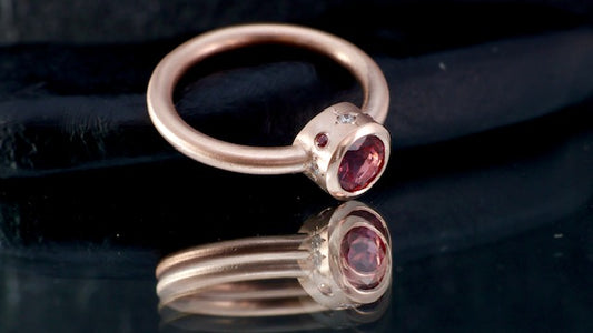 9. Robyn Clarke, Lagunas Ring 2, Laguna Colorado, 9ct rose gold, 6mm round pink tourmaline, 4 x 1.5mm FG/SI diamonds, 4 x 1.2mm Padparadscha  sapphores, size M