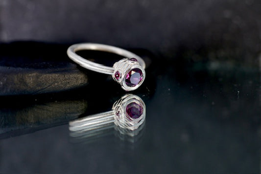 11. Robyn Clarke, Lagunas Ring 4, Laguna Colorado (contour line maquette), sterling silver, rhodolite garnets, size M