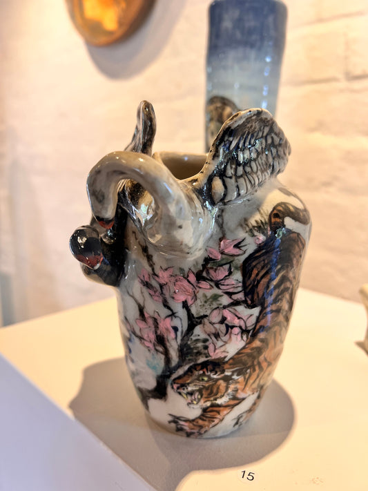 15. Annabelle Lowe, 2025, Thursday 4B, "Swan Vase". My piece is inspired by my culture and heritage. It depicts the conflict between the tiger and the dragon and the good and evil of the swans.