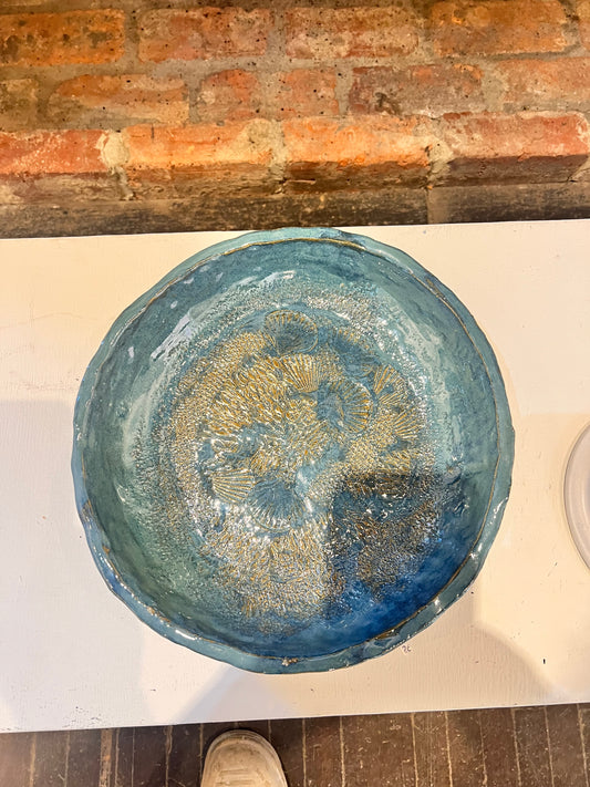 26. Lucas Macumber, 2025,Monday 1A, "Aussie Bird Bath", Bird bath featuring prints of different materials found outside on the grounds of Montsalvat