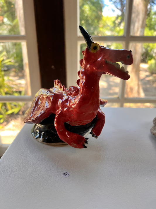 30. Jasper Hoyle, 2025, Monday 1A, "The Red Dragon". An ancient dragon sitting on the rock thats seen a thousand wars. Ceramic, stoneware